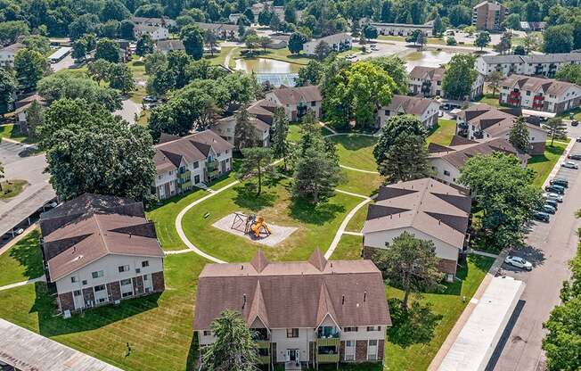 A bird's eye view of a neighborhood with houses and a playground.