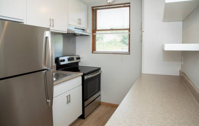 studio kitchen with floating shelves