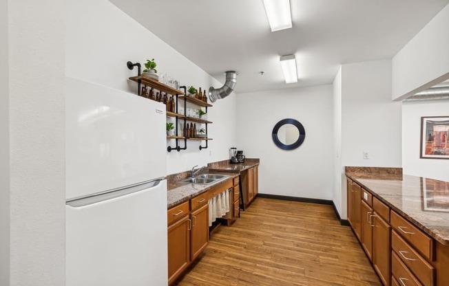 a kitchen with wooden cabinets and a white refrigerator