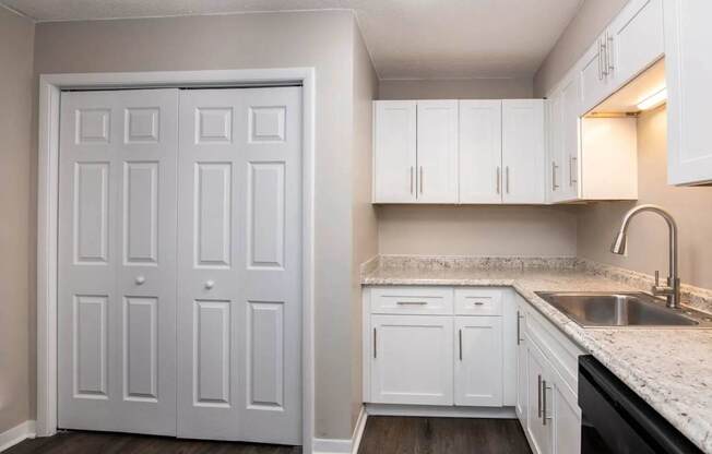 a white kitchen with at Cleo Apartments, Alabama, 35611