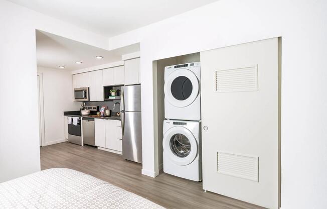 Enjoy the convenience of in-home laundry at Modera Woodstock, featuring a full-size washer and dryer for effortless living.