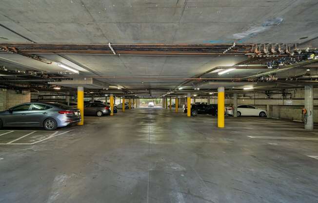 a parking garage with cars parked in it