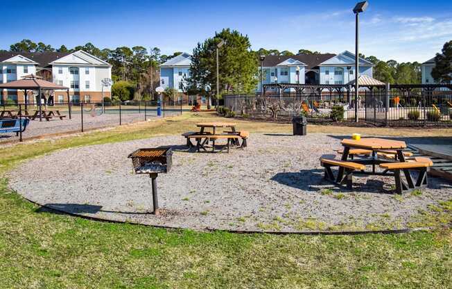 a picnic area at a park with picnic tables