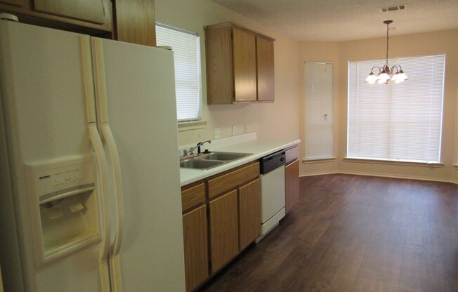 Cozy 3/2/2 one story with fence yard just west of I-35!