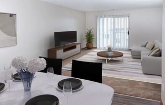 a living room with white walls and a white dining table with black chairs