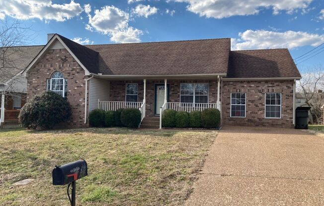 Sweet Ranch Home with Rocking Chair Front Porch