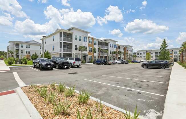 an empty parking lot in front of an apartment building at Drift, Daytona Beach, FL, 32117