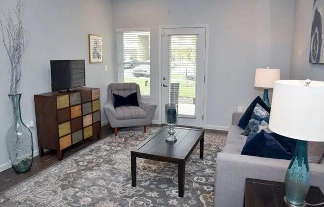 a living room with a couch a chair and a table