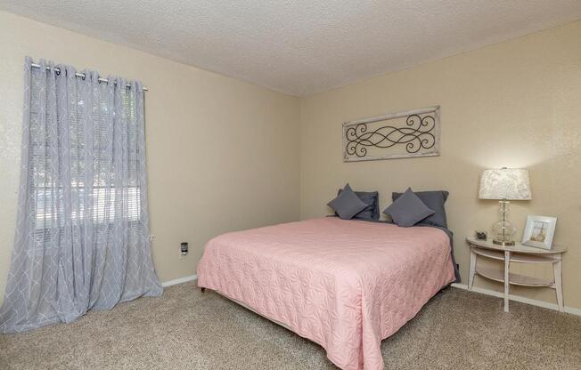 a bedroom with a bed in a hotel room