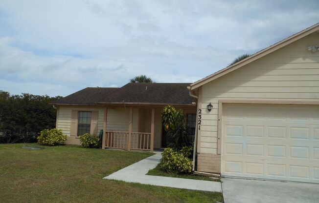 3 BEDROOM, 2 BATH CANAL FRONT HOME CONVENIENTLY LOCATED IN PORT ST LUCIE WITH A FENCED BACKED YARD, TILE & LAMINATE THROUGHOUT!