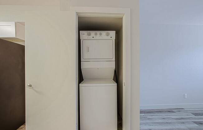 a room with a washer and dryer in it