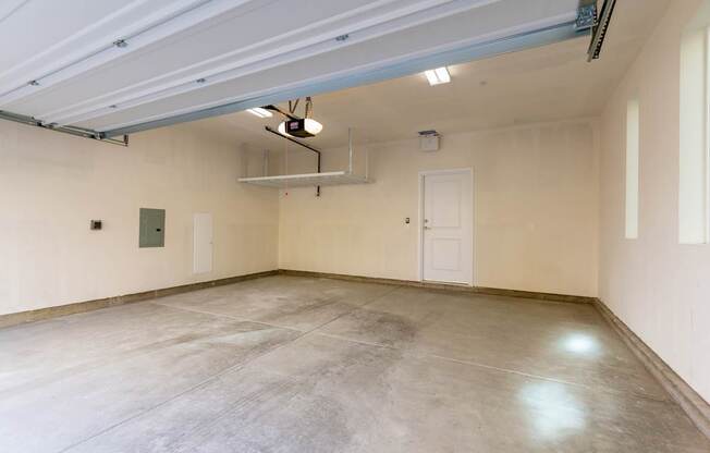 Garage with concrete floor and white walls.
