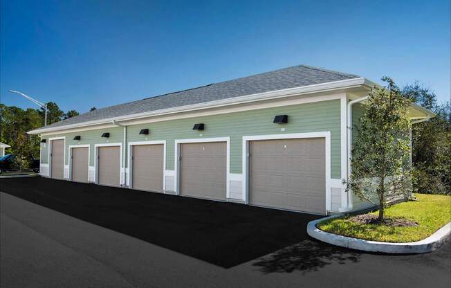 A two-story garage with a grey roof and white trim.