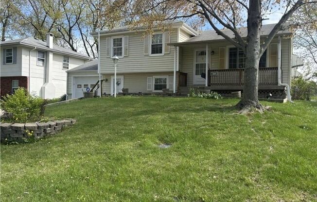NEW Lower Rate! Beautiful 4 Bedroom Home with extension work garage/work space