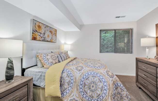 a bedroom with a bed and two night stands