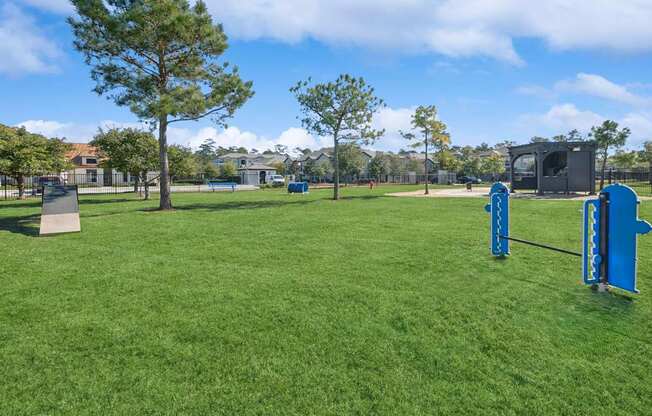 Dog park at Berkshire Jones Forest pet friendly apartments in Conroe, TX