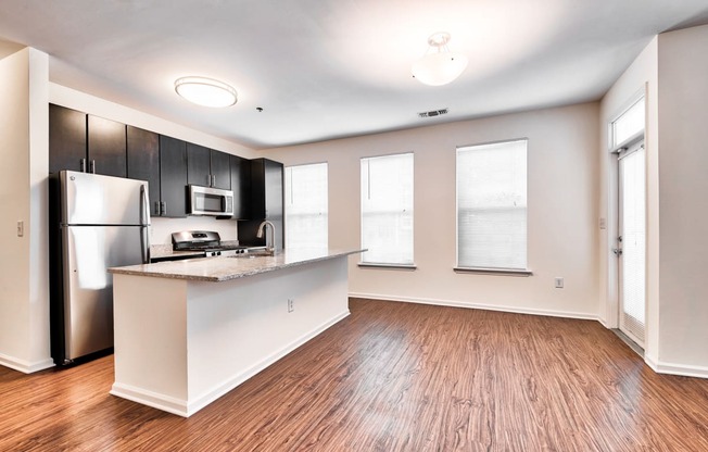 Open layouts with black walnut vinyl flooring at Windsor at Liberty House, 115 Morris Street, Jersey City