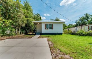 2 bed/1 bath, single-family home for rent in Aragon Park, with new window units!