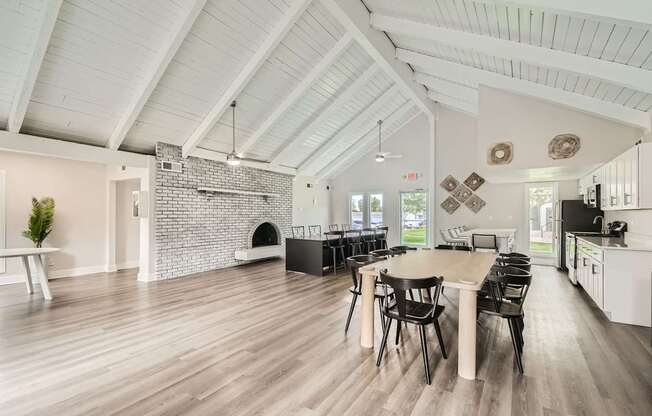 Aurora, CO Apartments – Aurora Meadows – A spacious clubhouse with a brick fireplace.