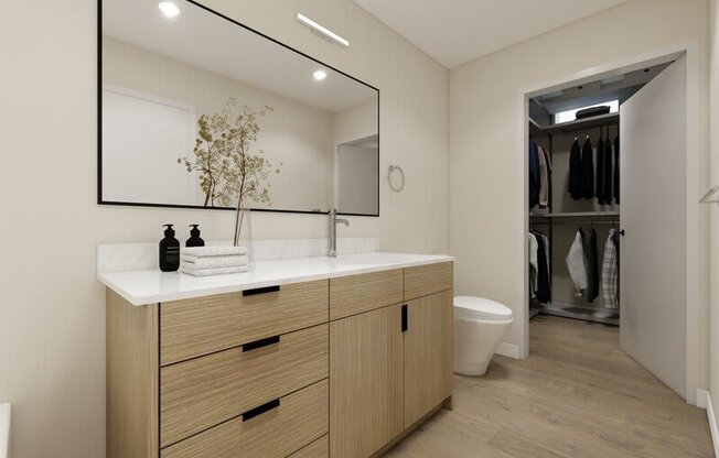 a bathroom with a large mirror at Lotus Republic Apartments for rent in Downtown Salt Lake City, Utah