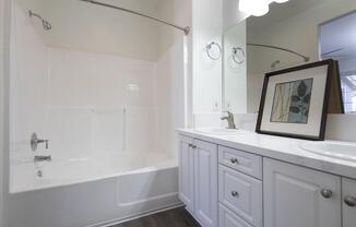a kitchen with a sink and a mirror