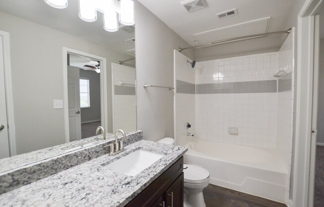upgraded bathroom with granite countertops, oversized garden tub at The Legends at Eagle Mountain Lake, Fort Worth, TX
