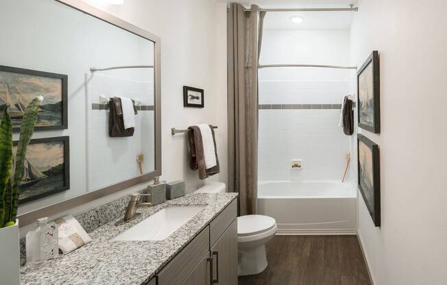 Bathrooms with Framed Mirrors and Granite Counters