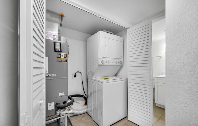 a small laundry room with a washer and dryer in it