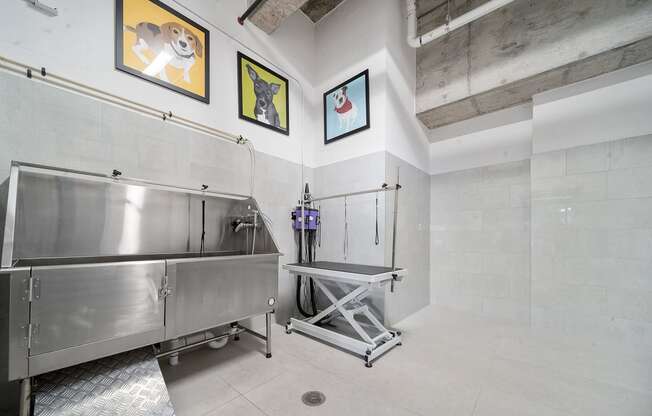 a kitchen with a large stainless steel sink and a walk in shower at Altis Grand Central, Tampa, 33606