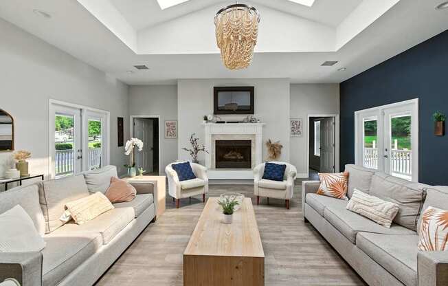 A living room with a fireplace and a television.