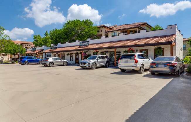 a parking lot with cars parked in front of a restaurant