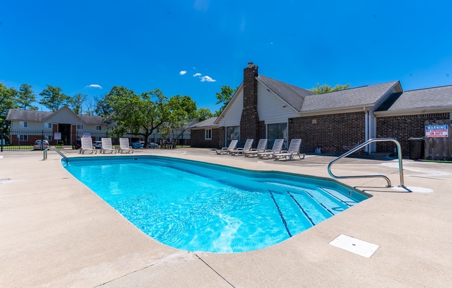 our resort style swimming pool is in front of our building with lounge chairs