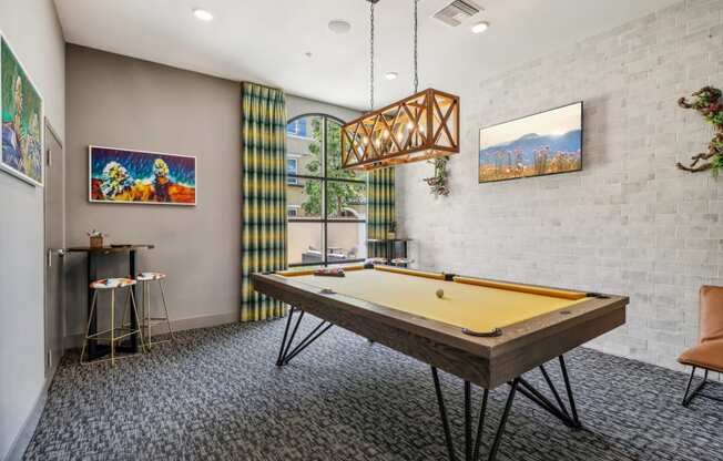 a game room with a pool table