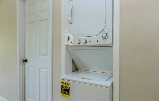 a washer and dryer are located in the laundry room