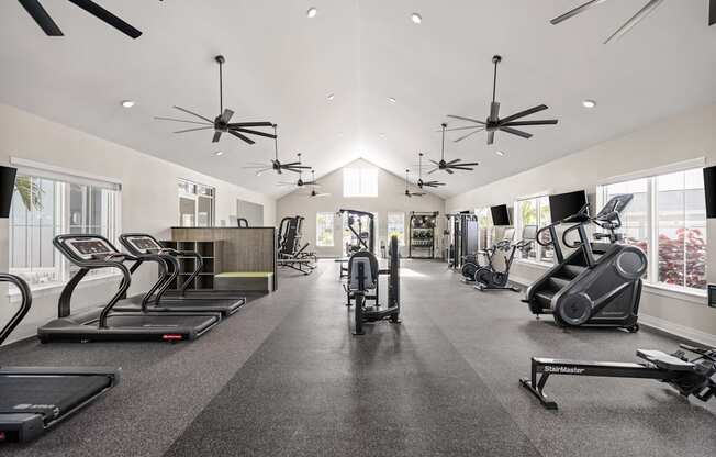 the gym with treadmills and other exercise equipment at Palm Grove in Ellenton, FL 34222