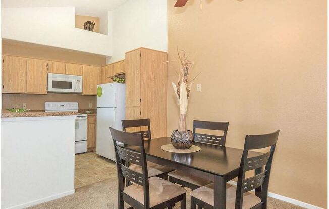 a kitchen and a dining room with a table and chairs at Riverview Springs, California
