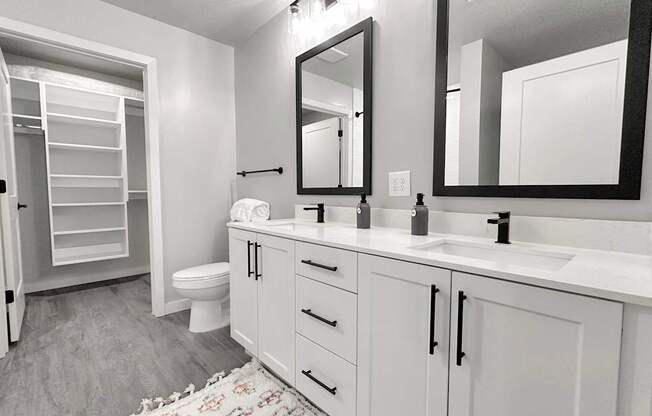 California-style walk-in closets, 42" white cabinetry, matte black fixtures and hardware