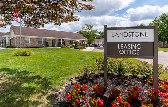 the sign in front of the leasing office at sands pointe apartments