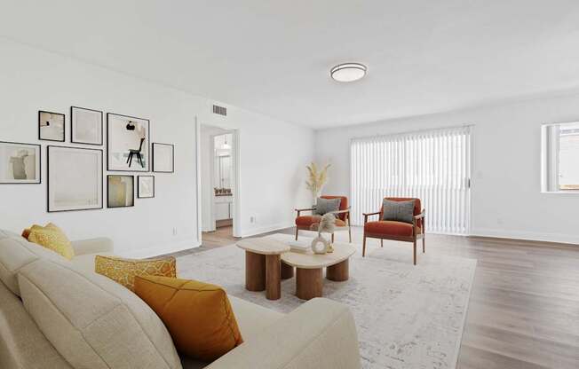 A living room with a beige couch and a coffee table.