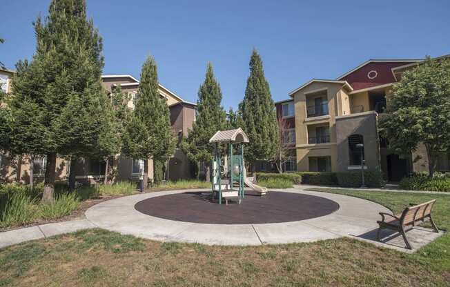 Tot Lot And Playing Field at Sterling Village Apartment Homes, California