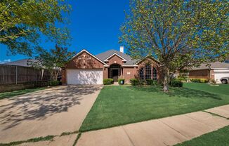 A must see Garland home in Rustic Oaks!!