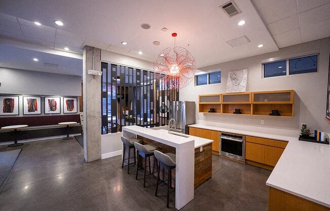 a kitchen and dining room with a table and chairs