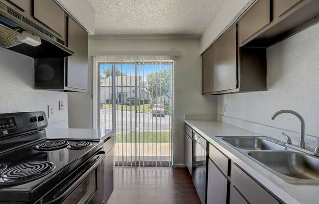 the preserve at ballantyne commons apartment kitchen with stainless steel appliances and a window