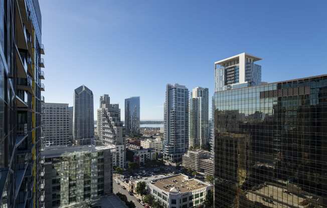 a view of the city from a skyscraper with tall buildings