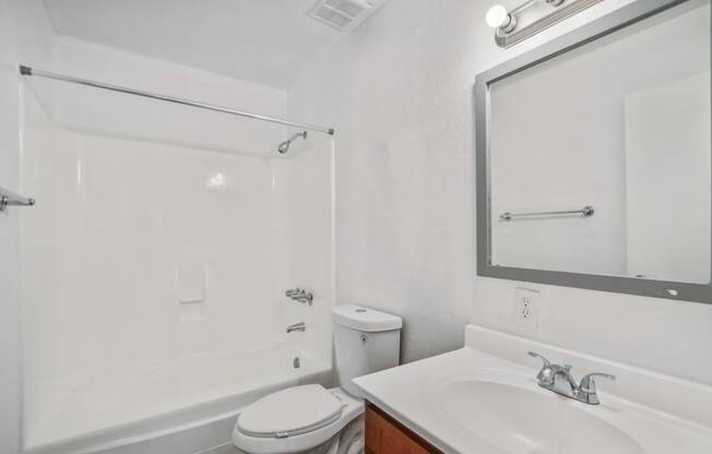 a bathroom with a sink toilet and a shower