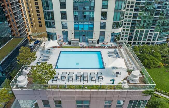 an aerial view of a pool on the roof of a building at Shoreham and Tides Apartments, Chicago, IL