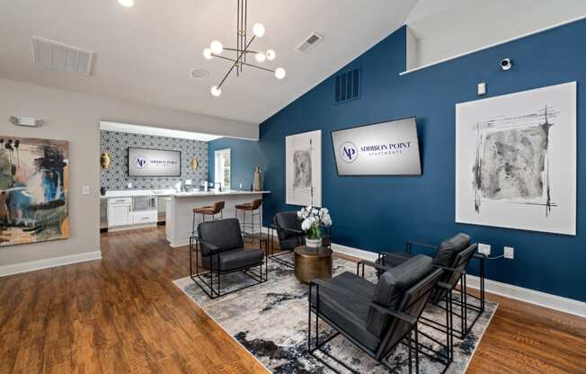 addison point interior resident lounge with blue walls and a table and chairs