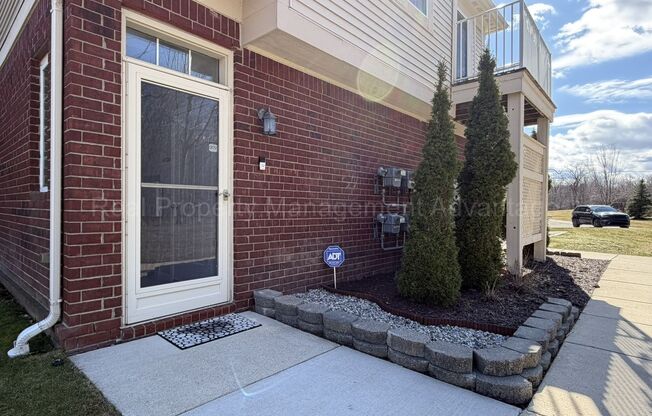 Rare Corner Upper Condo with Vaulted Ceilings, Private Balcony and 2 Car Garage - Right Across from the GM Tech Center!