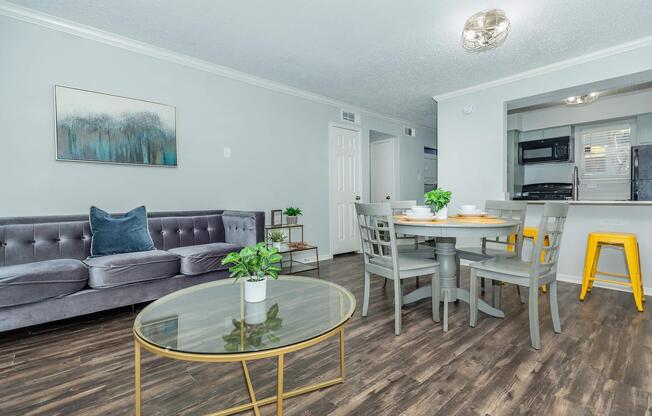 a living room filled with furniture and a table