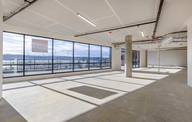 a large room with large windows and a column in the middle of the room at Marina Square, Washington, 98337